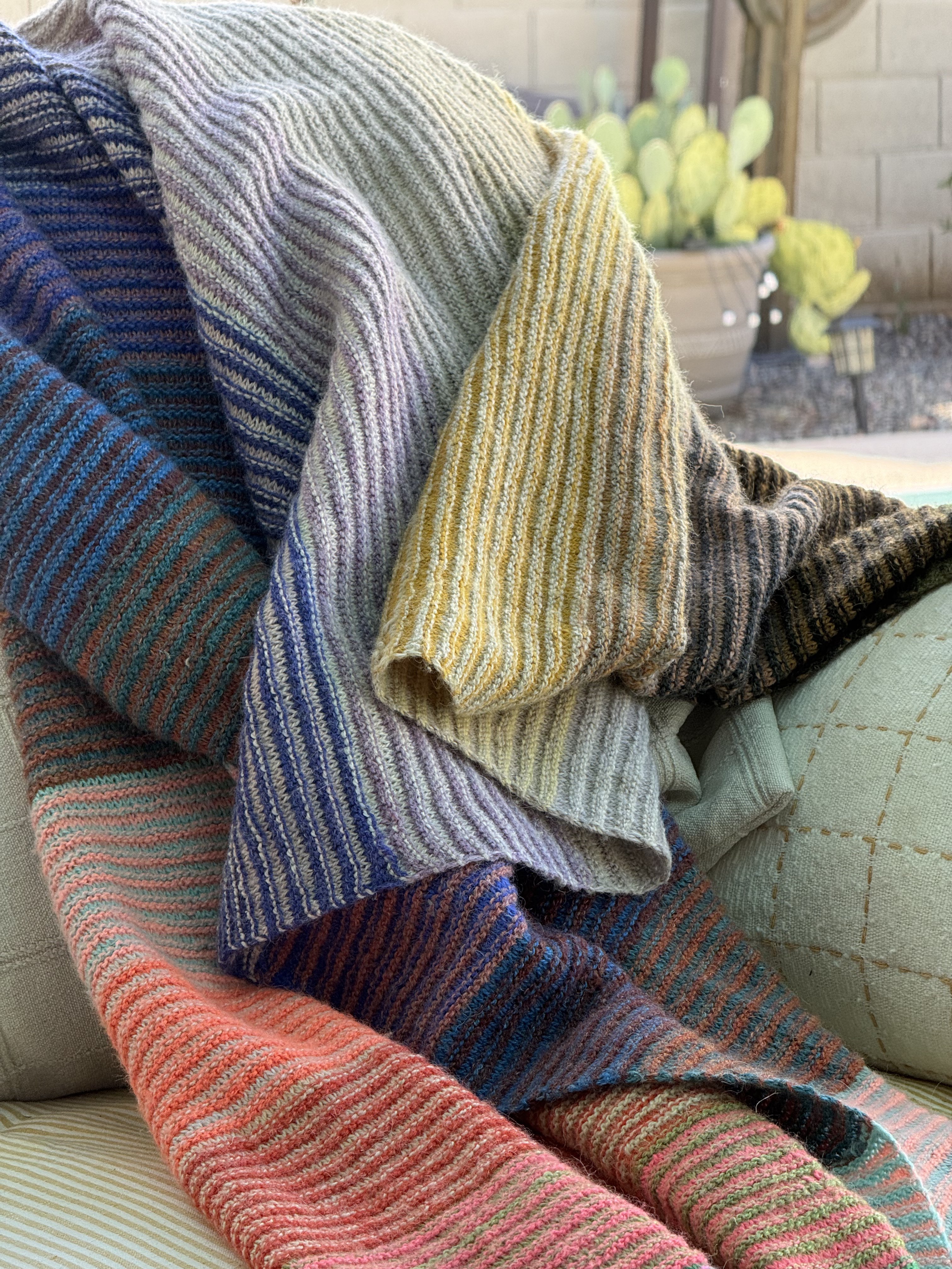 Close-up of the Alpenglow Blanket showing the color striping detail