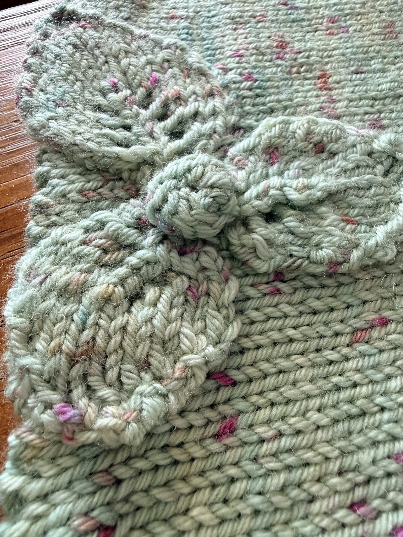 Macro detail of the knitted flower appliqué petals